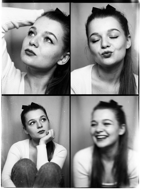 Photorealistic black-and-white vintage photobooth collage made of four frames in a 2x2 grid, separated by thin black dividers and surrounded by a slightly uneven paper border. Each frame shows the same woman in an intimate studio/photobooth setting against a plain light backdrop, captured with an authentic analog look: heavy film grain, soft contrast, halation, dusty scan artifacts, subtle scratches, and mild vignetting. Overall feel: 1990s/ early-2000s editorial photobooth print, raw and unretouched, candid "caught-between-moments" mood.
Use the uploaded photo as the basis and preserve the woman's face, makeup, likeness, and all original features without changing proportions or shape; keep natural facial micro-detail, pores, and subtle asymmetry, preserve the original head size.
Frame 1 (top-left): tight close-up, head tilted up and to the left, eyes looking upward, one arm raised behind the head, dreamy
Frame 2 (top-right): medium close-up, eyes closed, head slightly tilted, she subtly pushes/pouts her lips forward to show them (soft pout), calm playful mood; hair framing the face.
Frame 3 (bottom-left): medium close-up, seated with knees softly out of focus at the bottom, chin resting on one hand, gaze looking up to the right, thoughtful expression.
Frame 4 (bottom-right): medium close-up, the woman is laughing, but the frame is strongly blurred-heavy motion blur/defocus as if she moved during the shot; smile and face still recognizable, edges smeared, hair and hands noticeably streaked, imperfect photobooth misfire energy.
Print/scan look: monochrome with warm gray tones, slightly faded blacks, uneven exposure between frames, faint light leaks, paper texture visible, edges not perfectly straight, like a scanned photobooth print. High resolution, but intentionally imperfect, analog realism.