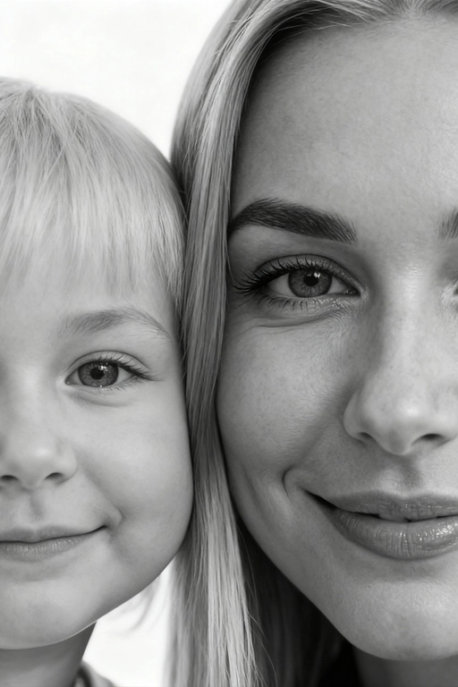 Сверхреалистичная черно-белая художественная фотография 8K женщины и ребенка, снятая очень крупным планом, щека к щеке так что видны только правая половина лица женщины и левая половина лица ребенка. которые смотрят в камеру. Их лица расположены рядом, почти соприкасаясь, образуя идеально сбалансированную симметричную композицию. Каждая деталь передана с фотографической точностью: тонкая текстура кожи и плавные градиенты света и тени. Видимая половина женщины включает ее бровь, один глаз , часть ее носа, щеку и губы, слегка приоткрытые в нежной, естественной улыбке, Видимая половина ребенка включает один глаз , круглую мягкую щеку, часть носа и небольшую улыбку, Фон белый и слегка размытый, что подчеркивает эмоциональную близость между ними. Освещение мягкое и рассеянное, создает деликатный контраст и тональную глубину. На снимке запечатлены нежность, близость и связь между матерью и ребенком, запечатленные с потрясающей реалистичностью. Не меняй черты лиц. 