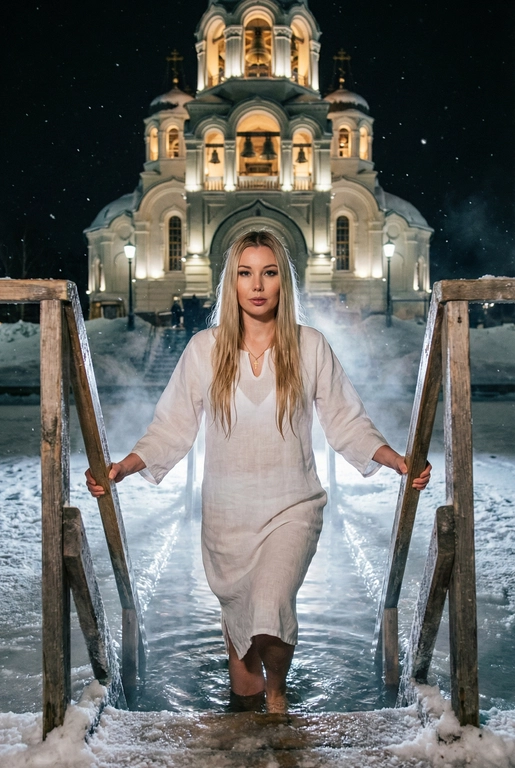   Создай изображение человека с исходного фото, человек держится за борты деревянной лестницы: если это женщина она одета в белую крестильную сорочку под ней белый купальник и крестик на шее, если это мужчина он одет в купальные шорты и с нательным крестиком на шее; человек заходит в священную зимнюю оборудованную купель. Задний план — большой красивый храм с художественной подсветкой и колоколами. Действие происходит ночью. Гиперреализм, высокая детализация, 8K, добавь зерно, взгляд в камеру.
