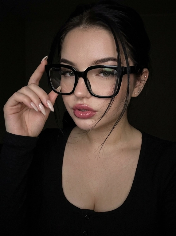 Максимально реалистичная фотография, темная винтажная эстетика в стиле dark glam glasses selfie, атмосферный ночной портрет.
Крупный портрет (Close-Up Portrait), кадр по грудь. Модель делает селфи, телефон не видно. Лицо занимает большую часть кадра, слегка повернуто вполоборота к камере. Голова немного наклонена. Взгляд направлен прямо в объектив, выражение спокойное, уверенное и притягательное. Губы слегка приоткрыты. Одна рука поднята к лицу и аккуратно касается оправы очков, словно поправляя их.
Макияж: Безупречный dark glam makeup. Ровный сияющий тон кожи, четко оформленные темные брови, длинные густые ресницы, тонкая стрелка, мягкий контуринг. Губы розово-винного оттенка с влажным глянцевым финишем.


Аксессуары: Крупные черные очки с прозрачными линзами и массивной квадратной оправой. На линзах заметны мягкие отражения света. Маленькие серьги-гвоздики. Длинный миндалевидный маникюр молочно-бежевого оттенка.

Одежда: Черный лонгслив с глубоким вырезом и небольшими пуговицами спереди. Темная ткань почти сливается с фоном, сохраняя видимую текстуру и силуэт.

Локация: Фон полностью черный.

Освещение: Мягкий приглушенный свет спереди и немного сбоку, словно от экрана телефона. Свет деликатно подсвечивает лицо, очки, губы, пальцы и ногти, оставляя волосы и одежду в глубоких тенях.

Камера: Реалистичное селфи высокого качества, RAW photo, натуральная перспектива смартфона, высокая детализация лица и аксессуаров.

Глубина резкости: Небольшая. Лицо, очки, губы и рука находятся в фокусе, фон растворяется в мягкой темноте.

Кожа: Реалистичная текстура кожи с видимыми порами, естественными переходами света и тени, без эффекта пластика и чрезмерной ретуши.

Детали: Блики на линзах очков, влажный блеск губ, отдельные волоски и пряди на лице, текстура ткани, отражения света на ногтях, легкое пленочное зерно.

Атмосфера: Загадочный ночной вайб, уверенность, женственность, винтажная эстетика, ощущение случайного красивого селфи в темноте.

Какая будет прическа?: Волосы перекинуты на одну сторону. Несколько тонких прядей проходят через щеку и губы, создавая живой эффект движения. Видна естественная текстура и мягкий блеск.