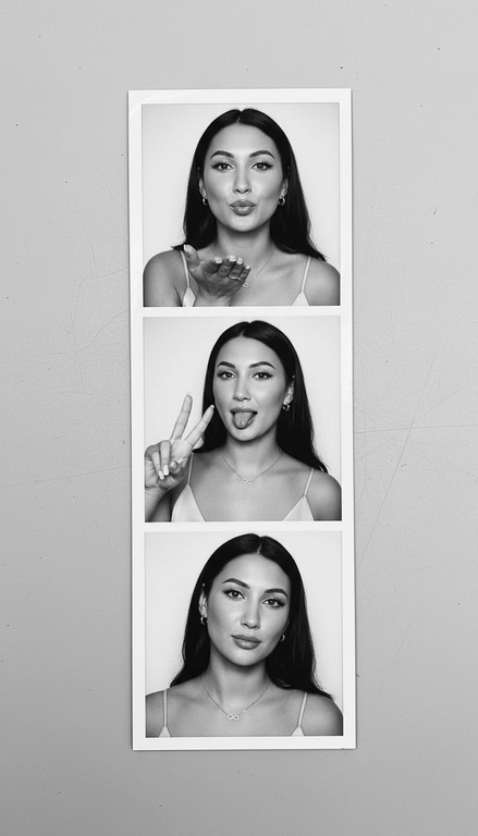  Используя мою фотографию в качестве референса для лица и волос, не изменяя исходные черты лица и сохраняя верность моим физическим характеристикам, создайте ленту из фотографий в ч/б с тремя вертикальными белыми рамками. Лента выглядит так, будто лежит на столе или фоне. Фотографии выглядят профессионально , как будто из настоящей фотобудки. 

В каждой рамке по центру расположены портрет и фотография погрудной проекции одного и того же человека. Взгляд прямо в камеру.

Общая эстетика винтажная, с лёгкой зернистостью и выцветшим качеством, напоминающая классическую аналоговую фотографию. Но при этом изображение выполнено в высоком разрешении. На светло-сером фоне видны едва заметные следы пыли и царапин. Лица человека на белом фоне. 
НЕ ИЗМЕНЯЙТЕ МОЁ ЛИЦО. На верхнем фото девушка посылает зрителю воздушный поцелуй, поднеся правую руку ко рту и слегка поджав губы. Выражение её лица игривое и дружелюбное.  На среднем фото девушка мило и игриво показывает знак мира, высунув язык. Брови слегка приподняты. На нижнем фото девушка позирует, отвернувшись к плечу, смотрит прямо в камеру с более спокойным и уверенным выражением лица. Губы мягко сжаты, взгляд прямой и чувственный. ОДЕЖДА: На ней маленькие серьги-кольца и изящное ожерелье с символом бесконечности поверх светлого атласного или шёлкового топа. На ней естественный макияж, включая глянцевый блеск для губ, лёгкую подводку для глаз и кукольные нарощенные ресницы, без излишеств. У неё квадратный французский маникюр. 