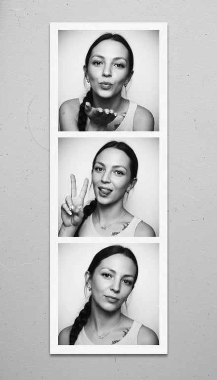  Используя мою фотографию в качестве референса для лица и волос, не изменяя исходные черты лица и сохраняя верность моим физическим характеристикам, создайте ленту из фотографий в ч/б с тремя вертикальными белыми рамками. Лента выглядит так, будто лежит на столе или фоне. Фотографии выглядят профессионально , как будто из настоящей фотобудки. 

В каждой рамке по центру расположены портрет и фотография погрудной проекции одного и того же человека. Взгляд прямо в камеру.

Общая эстетика винтажная, с лёгкой зернистостью и выцветшим качеством, напоминающая классическую аналоговую фотографию. Но при этом изображение выполнено в высоком разрешении. На светло-сером фоне видны едва заметные следы пыли и царапин. Лица человека на белом фоне. 
НЕ ИЗМЕНЯЙТЕ МОЁ ЛИЦО. На верхнем фото девушка посылает зрителю воздушный поцелуй, поднеся правую руку ко рту и слегка поджав губы. Выражение её лица игривое и дружелюбное.  На среднем фото девушка мило и игриво показывает знак мира, высунув язык. Брови слегка приподняты. На нижнем фото девушка позирует, отвернувшись к плечу, смотрит прямо в камеру с более спокойным и уверенным выражением лица. Губы мягко сжаты, взгляд прямой и чувственный. ОДЕЖДА: На ней маленькие серьги-кольца и изящное ожерелье с символом бесконечности поверх светлого атласного или шёлкового топа. На ней естественный макияж, включая глянцевый блеск для губ, лёгкую подводку для глаз и кукольные нарощенные ресницы, без излишеств. У неё квадратный французский маникюр. 