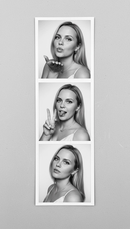  Используя мою фотографию в качестве референса для лица и волос, не изменяя исходные черты лица и сохраняя верность моим физическим характеристикам, создайте ленту из фотографий в ч/б с тремя вертикальными белыми рамками. Лента выглядит так, будто лежит на столе или фоне. Фотографии выглядят профессионально , как будто из настоящей фотобудки. 

В каждой рамке по центру расположены портрет и фотография погрудной проекции одного и того же человека. Взгляд прямо в камеру.

Общая эстетика винтажная, с лёгкой зернистостью и выцветшим качеством, напоминающая классическую аналоговую фотографию. Но при этом изображение выполнено в высоком разрешении. На светло-сером фоне видны едва заметные следы пыли и царапин. Лица человека на белом фоне. 
НЕ ИЗМЕНЯЙТЕ МОЁ ЛИЦО. На верхнем фото девушка посылает зрителю воздушный поцелуй, поднеся правую руку ко рту и слегка поджав губы. Выражение её лица игривое и дружелюбное.  На среднем фото девушка мило и игриво показывает знак мира, высунув язык. Брови слегка приподняты. На нижнем фото девушка позирует, отвернувшись к плечу, смотрит прямо в камеру с более спокойным и уверенным выражением лица. Губы мягко сжаты, взгляд прямой и чувственный. ОДЕЖДА: На ней маленькие серьги-кольца и изящное ожерелье с символом бесконечности поверх светлого атласного или шёлкового топа. На ней естественный макияж, включая глянцевый блеск для губ, лёгкую подводку для глаз и кукольные нарощенные ресницы, без излишеств. У неё квадратный французский маникюр. 