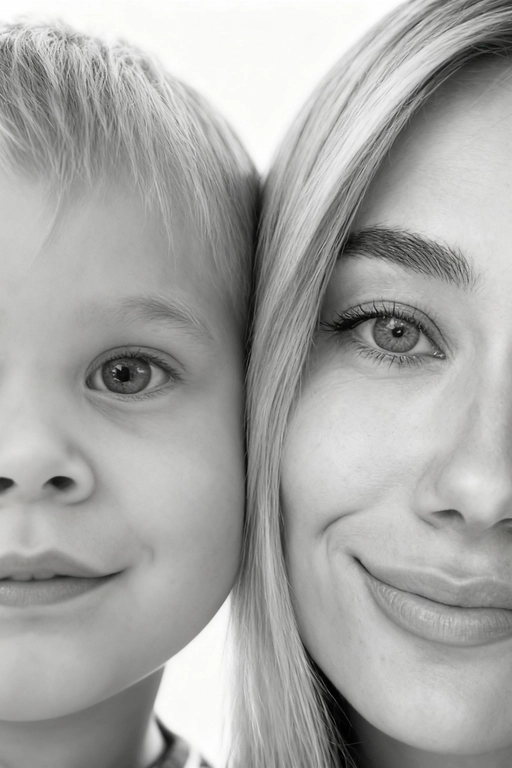 Сверхреалистичная черно-белая художественная фотография 8K женщины и ребенка, снятая очень крупным планом, щека к щеке так что видны только правая половина лица женщины и левая половина лица ребенка. которые смотрят в камеру. Их лица расположены рядом, почти соприкасаясь, образуя идеально сбалансированную симметричную композицию. Каждая деталь передана с фотографической точностью: тонкая текстура кожи и плавные градиенты света и тени. Видимая половина женщины включает ее бровь, один глаз , часть ее носа, щеку и губы, слегка приоткрытые в нежной, естественной улыбке, Видимая половина ребенка включает один глаз , круглую мягкую щеку, часть носа и небольшую улыбку, Фон белый и слегка размытый, что подчеркивает эмоциональную близость между ними. Освещение мягкое и рассеянное, создает деликатный контраст и тональную глубину. На снимке запечатлены нежность, близость и связь между матерью и ребенком, запечатленные с потрясающей реалистичностью. Не меняй черты лиц. 