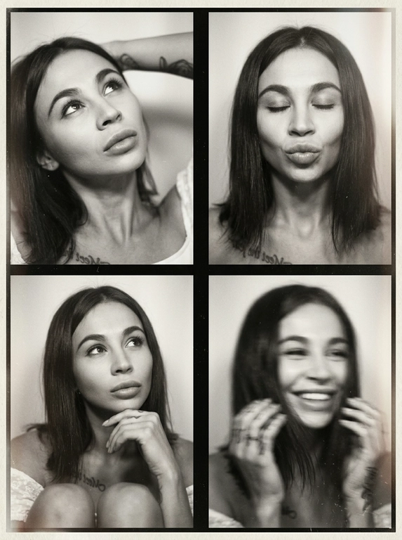 Photorealistic black-and-white vintage photobooth collage made of four frames in a 2x2 grid, separated by thin black dividers and surrounded by a slightly uneven paper border. Each frame shows the same woman in an intimate studio/photobooth setting against a plain light backdrop, captured with an authentic analog look: heavy film grain, soft contrast, halation, dusty scan artifacts, subtle scratches, and mild vignetting. Overall feel: 1990s/ early-2000s editorial photobooth print, raw and unretouched, candid "caught-between-moments" mood.
Use the uploaded photo as the basis and preserve the woman's face, makeup, likeness, and all original features without changing proportions or shape; keep natural facial micro-detail, pores, and subtle asymmetry, preserve the original head size.
Frame 1 (top-left): tight close-up, head tilted up and to the left, eyes looking upward, one arm raised behind the head, dreamy
Frame 2 (top-right): medium close-up, eyes closed, head slightly tilted, she subtly pushes/pouts her lips forward to show them (soft pout), calm playful mood; hair framing the face.
Frame 3 (bottom-left): medium close-up, seated with knees softly out of focus at the bottom, chin resting on one hand, gaze looking up to the right, thoughtful expression.
Frame 4 (bottom-right): medium close-up, the woman is laughing, but the frame is strongly blurred-heavy motion blur/defocus as if she moved during the shot; smile and face still recognizable, edges smeared, hair and hands noticeably streaked, imperfect photobooth misfire energy.
Print/scan look: monochrome with warm gray tones, slightly faded blacks, uneven exposure between frames, faint light leaks, paper texture visible, edges not perfectly straight, like a scanned photobooth print. High resolution, but intentionally imperfect, analog realism.
