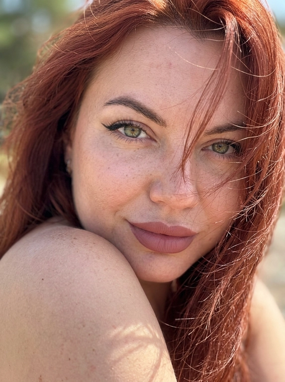 Ультрареалистичная фотография, случайный живой портрет, снятый на iPhone 17 Pro. Эффект настоящего кадра, сделанного в моменте, без постановочности, без фильтров и ретуши.

Внешность полностью сохранена без изменений. Женщина смотрит прямо в камеру. Голова слегка наклонена в сторону и опирается на плечо, плечо частично закрывает лицо. Выражение загадочное, притягательное и естественное.
Волосы активно развеваются ветром, отдельные пряди частично закрывают лицо и глаза, создавая эффект живого случайного кадра. Максимальная детализация отдельных волосков.

Легкий макияж с акцентом на глаза: длинные объемные ресницы, стрелки cat-eye на верхнем веке, идеально оформленные брови. Нюдовая матовая помада оттенка пыльной розы с контуром на тон темнее, влажный хайлайтер на скулах и переносице.

Одежда не видна. Основной акцент на лице, глазах и волосах.

Яркий прямой солнечный свет падает под углом на лицо, интенсивно подсвечивая глаза, подчеркивая глубину радужки, длинные ресницы и естественные блики в глазах. Солнечные лучи создают красивые световые акценты в волосах и на коже.

Естественная текстура кожи с видимыми порами, микрорельефом, легкими несовершенствами, едва заметными капиллярами в глазах. Живая кожа без эффекта пластика. Легкий цифровой шум, характерный для реальной фотографии.

Shot on iPhone 17 Pro, natural light, candid portrait, hyper detailed iris, visible skin pores, realistic skin texture, unedited RAW photo, depth of field, soft highlights, windblown hair, authentic photography, photorealistic, ultra realistic, 8k.